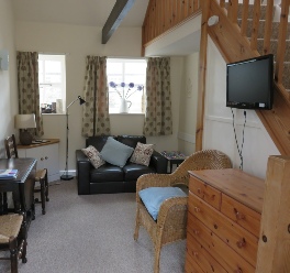 Image of the living room in Horseshoe and Anvil self-catering cottages at The Old Forge, Wilton
