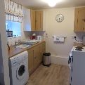 Image of the kitchen in Horseshoe and Anvil self-catering cottages, The Old Forge, Wilton