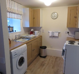 Image of the kitchen in Horseshoe and Anvil self-catering cottages at The Old Forge, Wilton